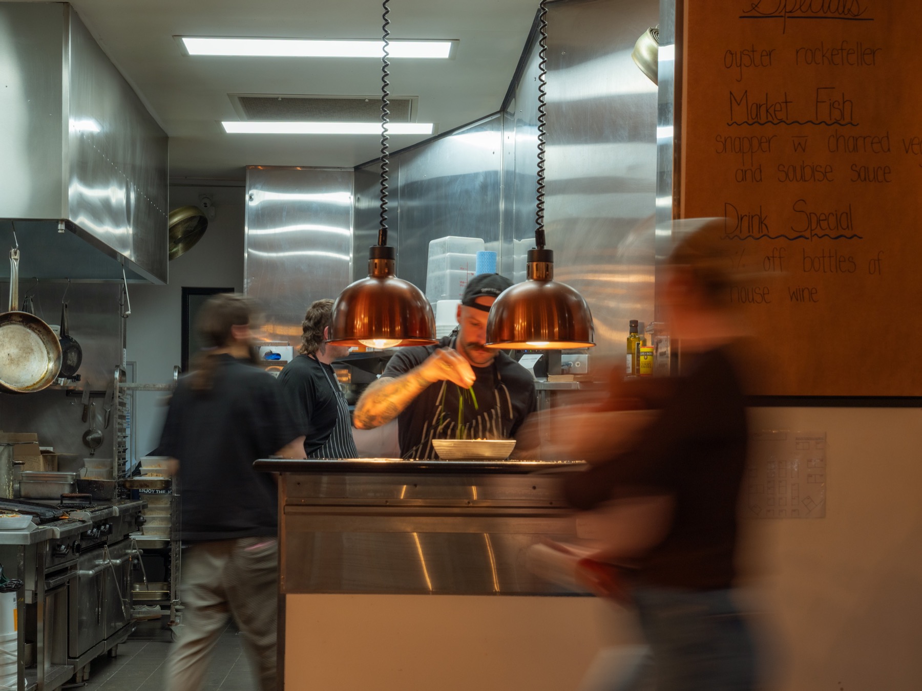 The Wharf kitchen team plating a dish